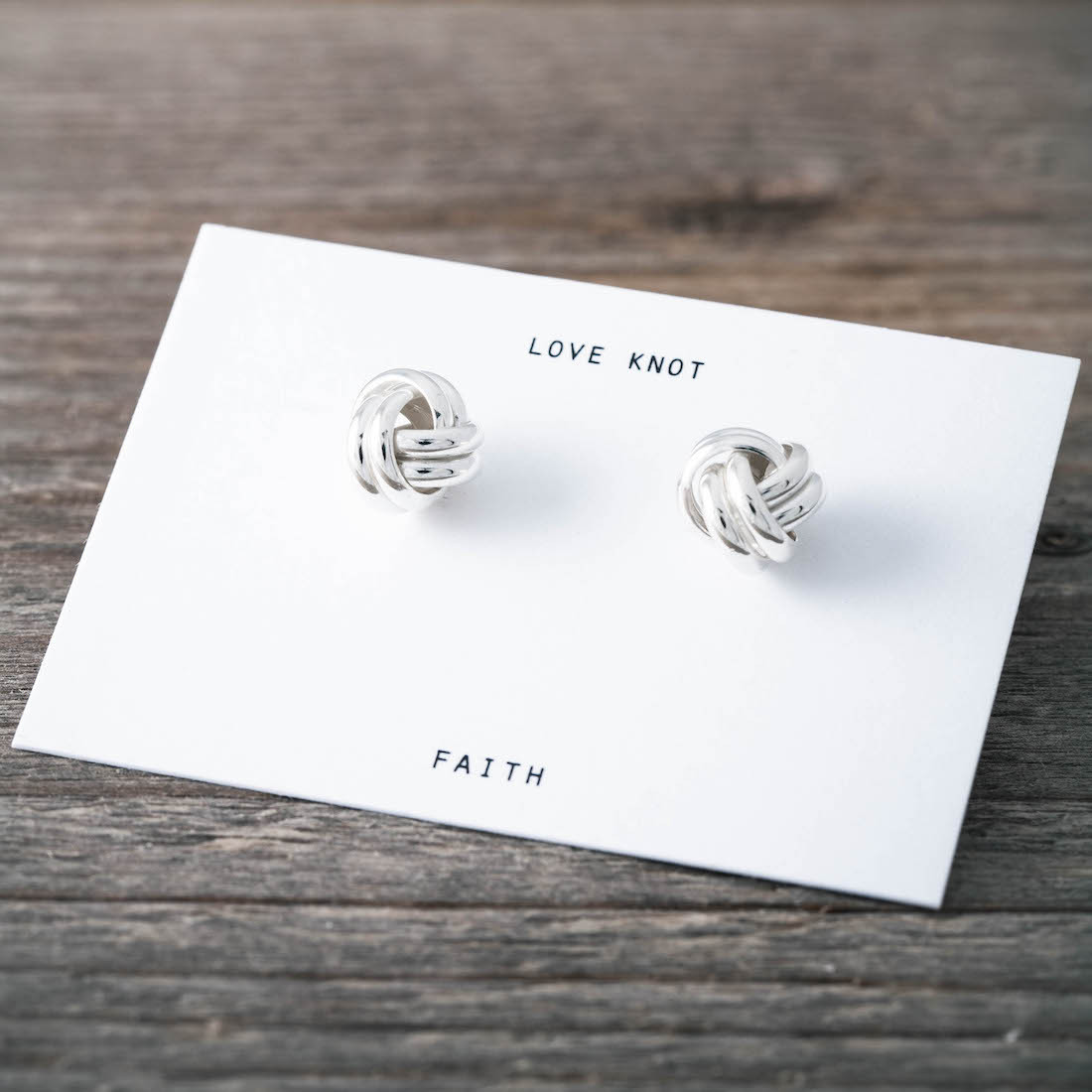 Silver earrings round knot