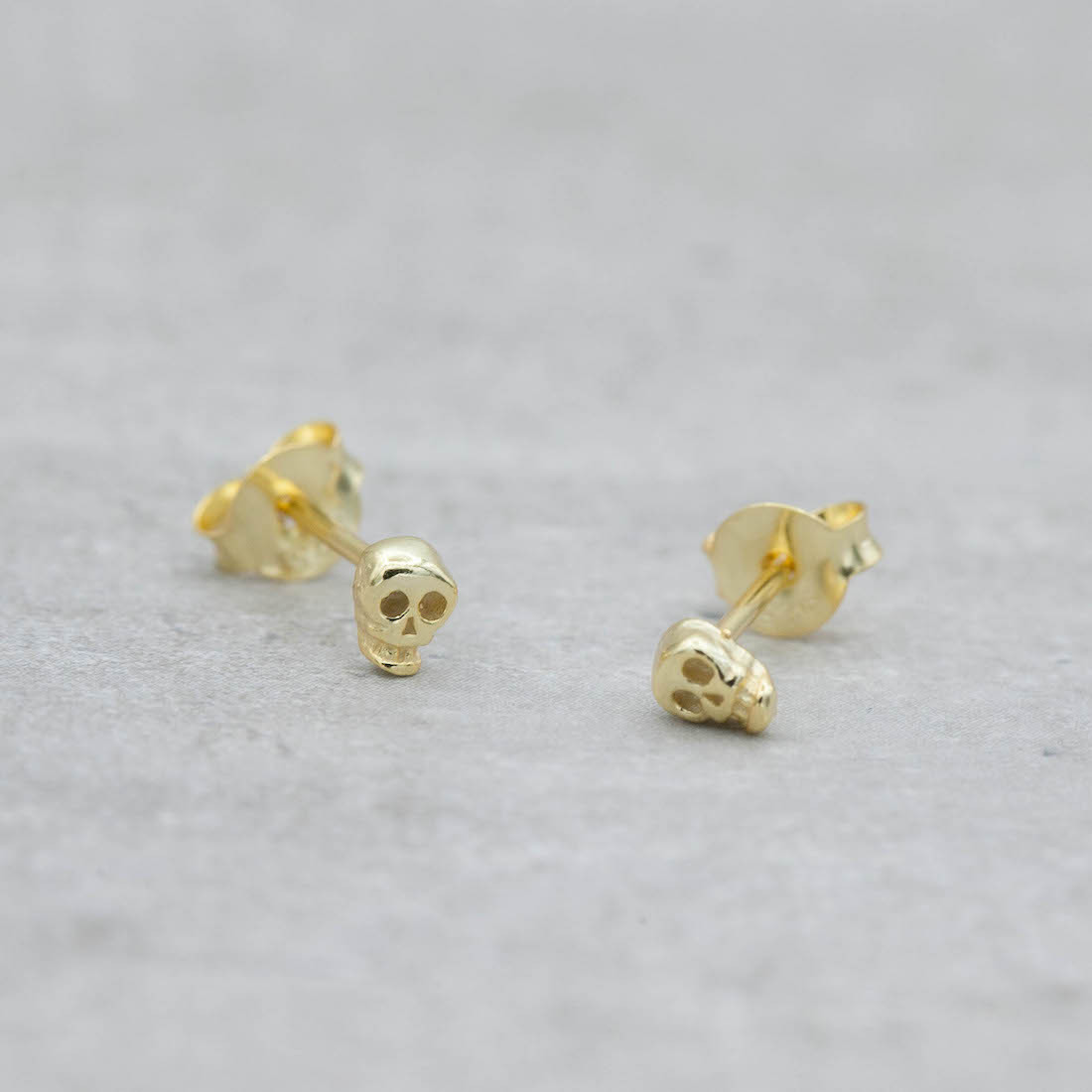 Gold earrings mini skull