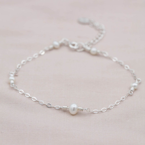 Silver bracelet with 5 freshwater pearls around