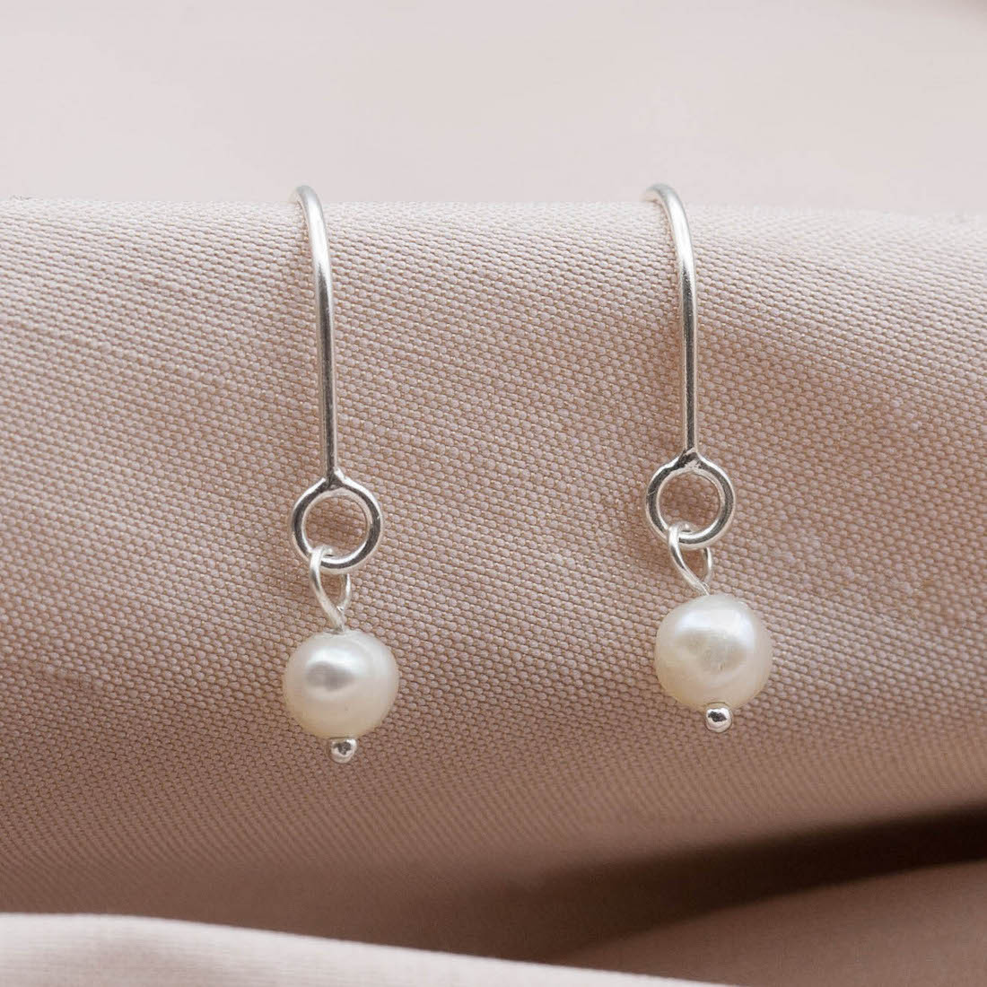 Silver earrings hanging pearl