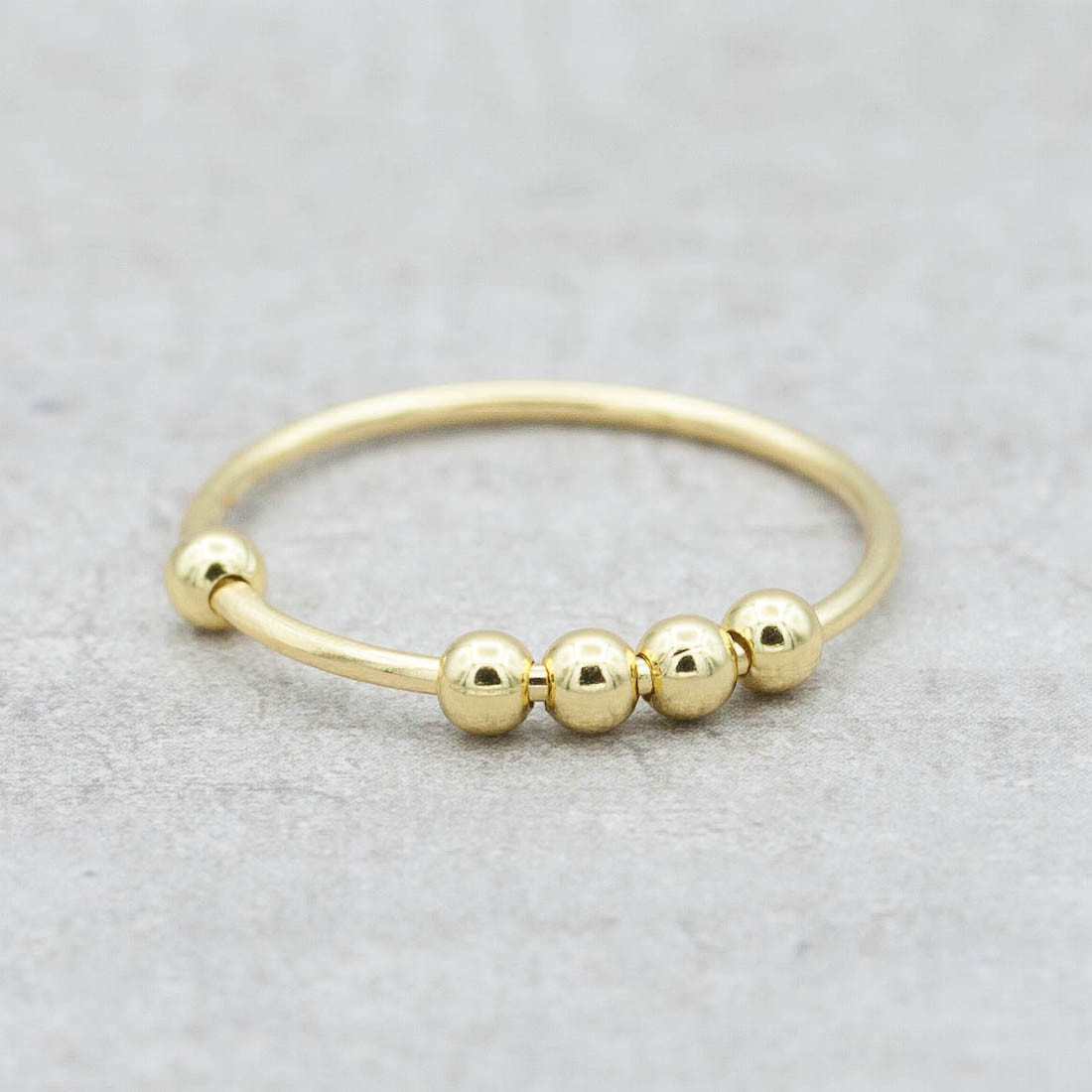 Gold ring movable beads