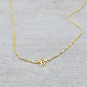 Gold necklace swallow
