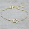 Gold bracelet with open star