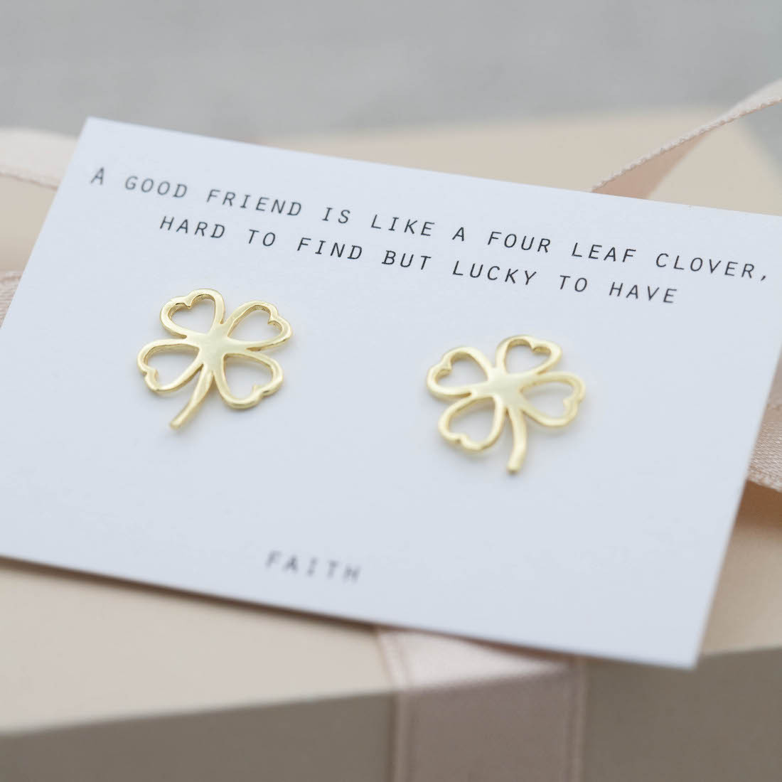 Gold earrings contour four leaf clover
