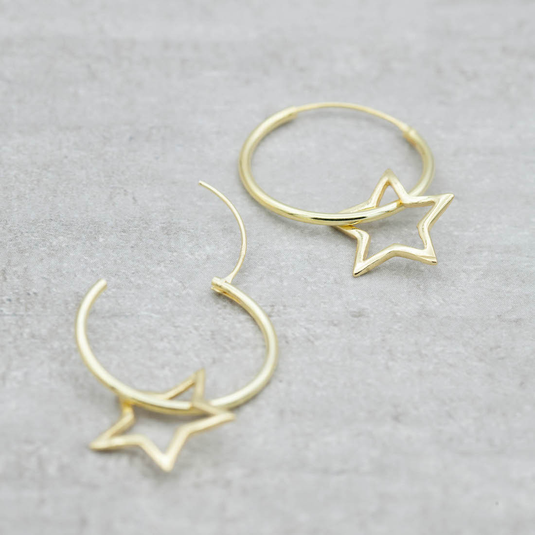 Gold earrings creole with big  star