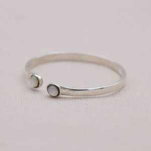 Silver ring with two small moonstones