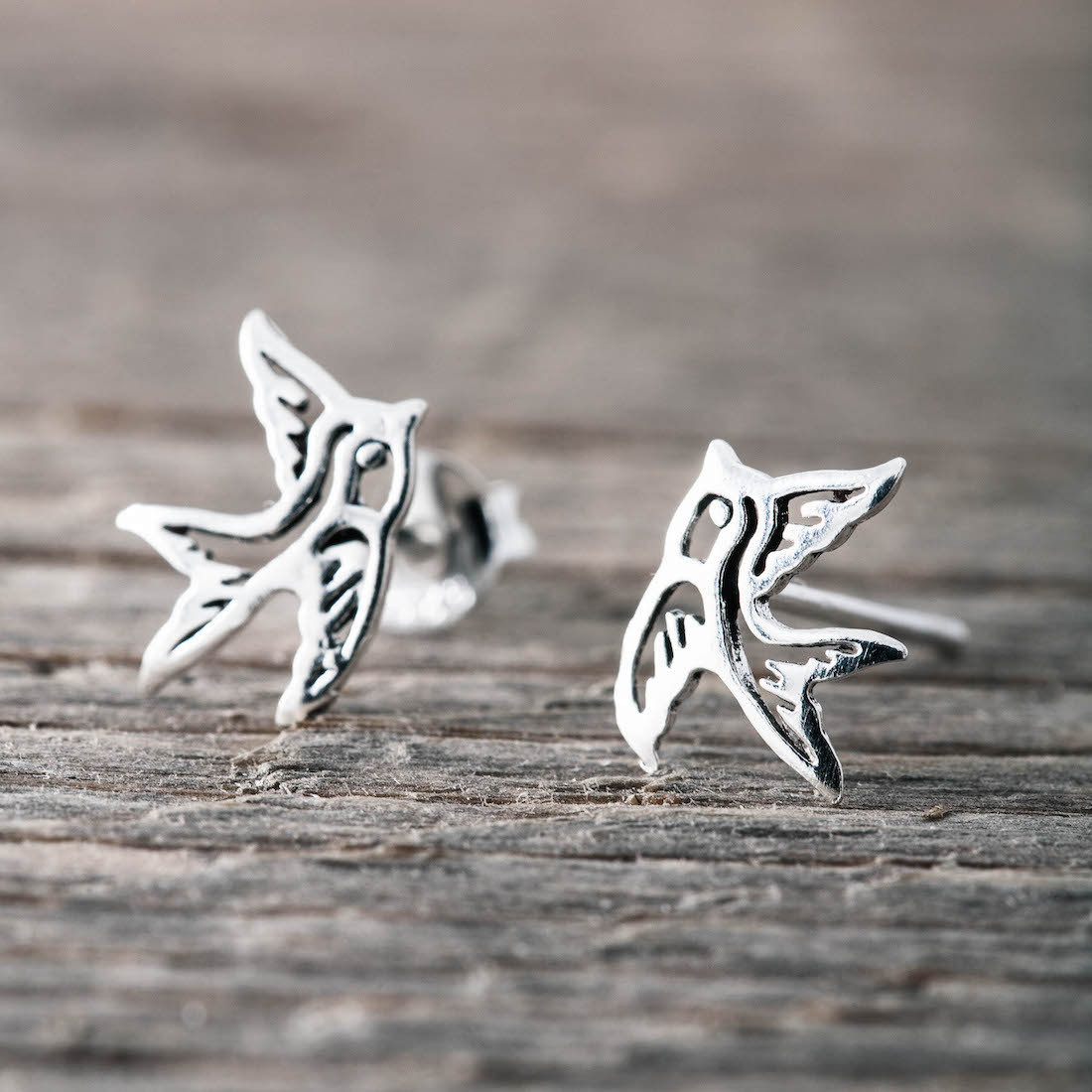 Silver earrings contour swallow