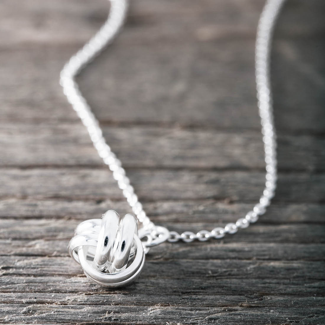 Silver necklace round knot