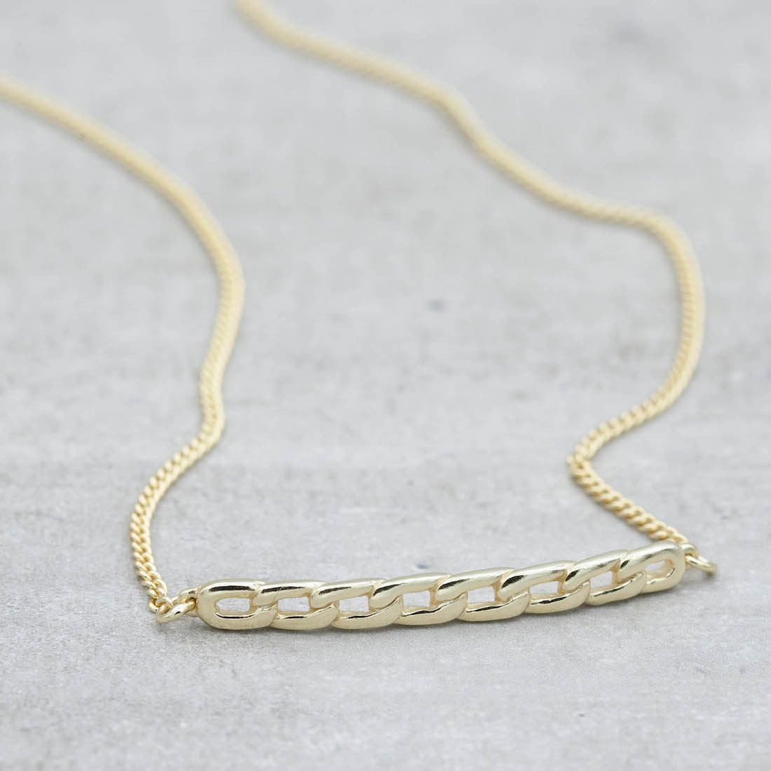 Gold necklace chain bar