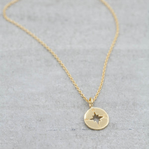 Gold necklace compass