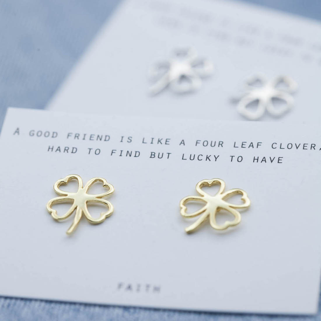 Gold earrings contour four leaf clover
