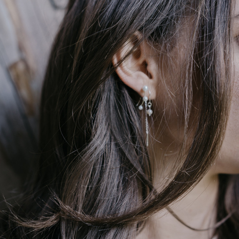 Silver earrings hanging pearl