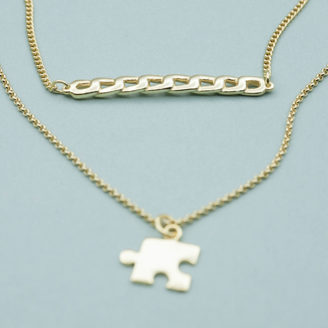 Gold necklace chain bar