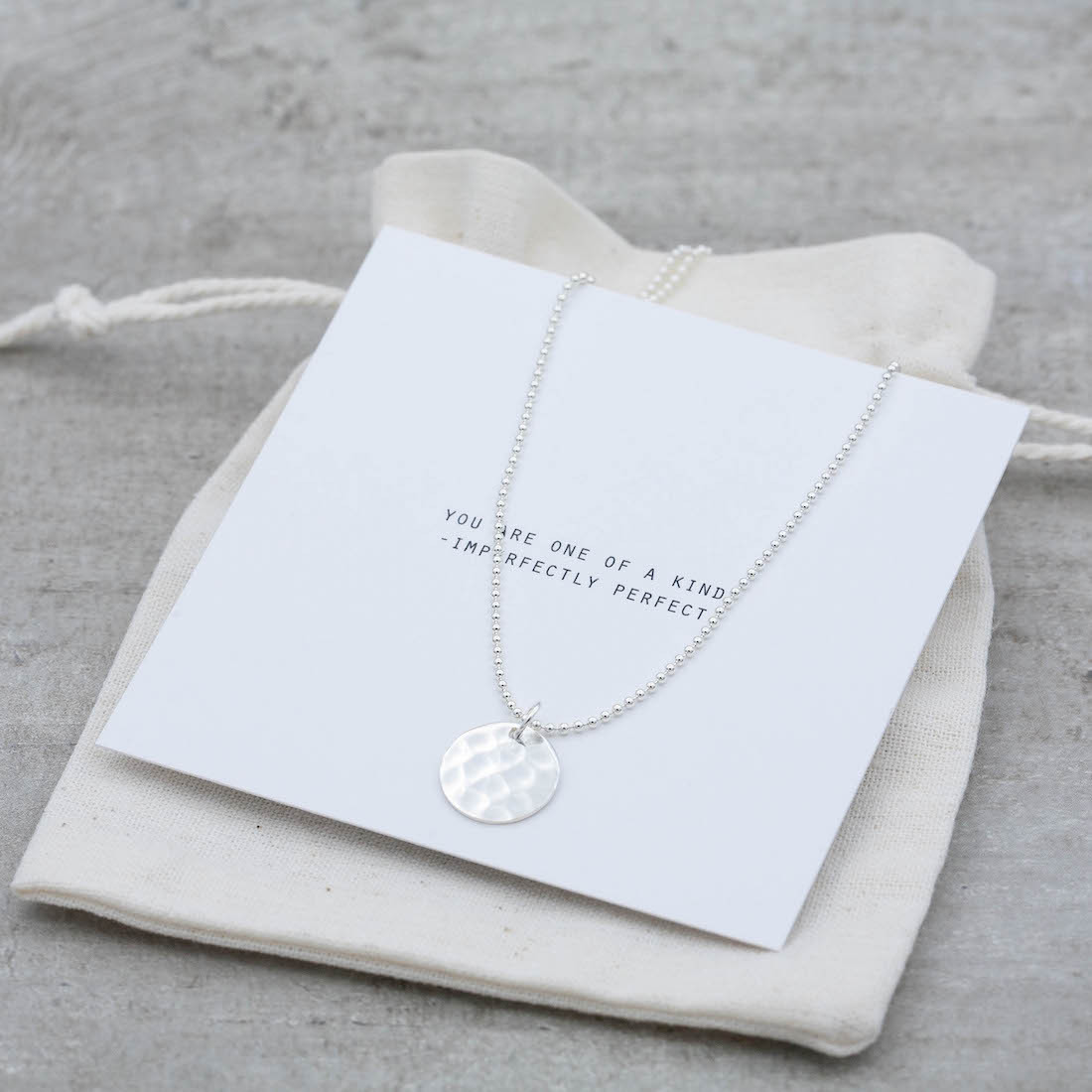 Silver necklace hammered disc