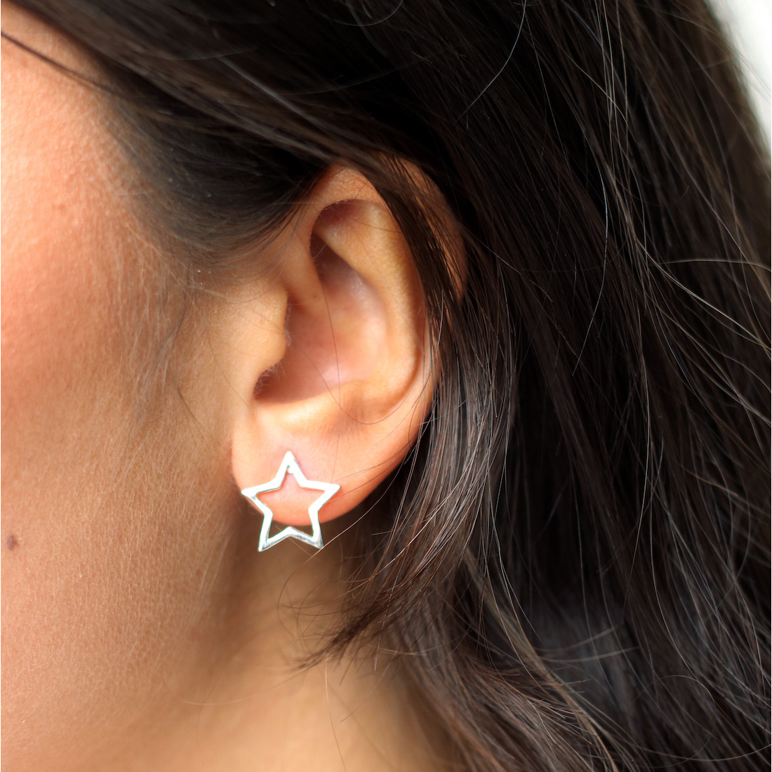 Gold earrings contour star