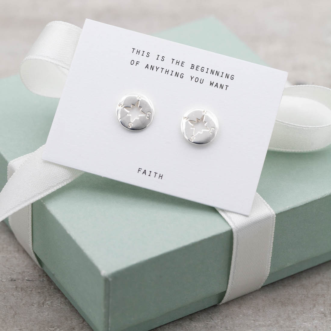 Silver earrings compass