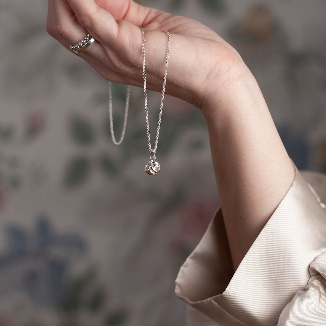Silver necklace round knot
