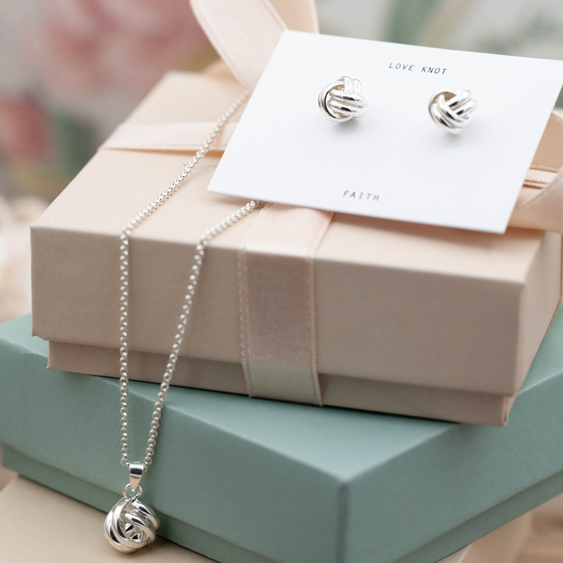Silver earrings round knot