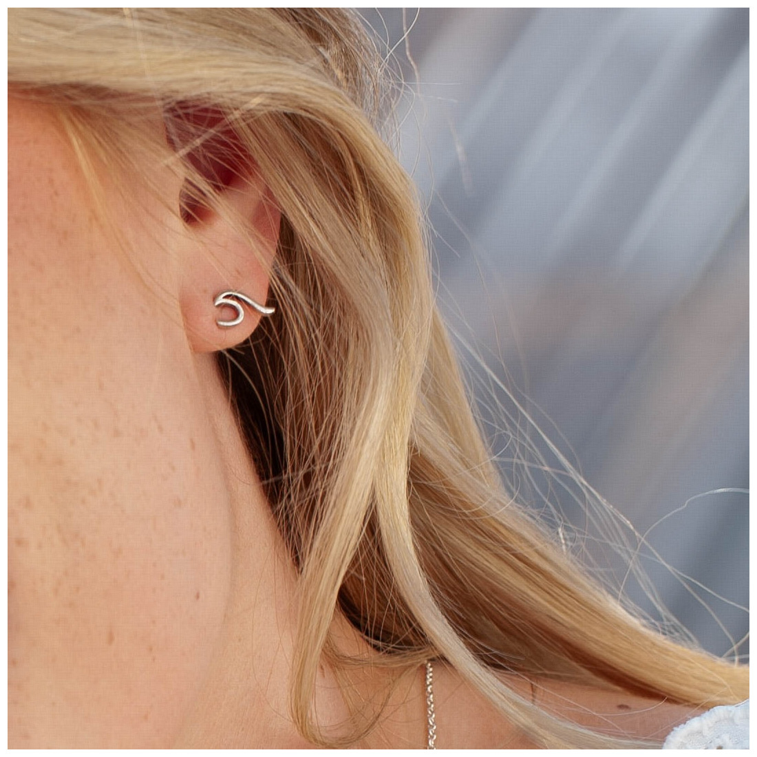 Silver earrings wave