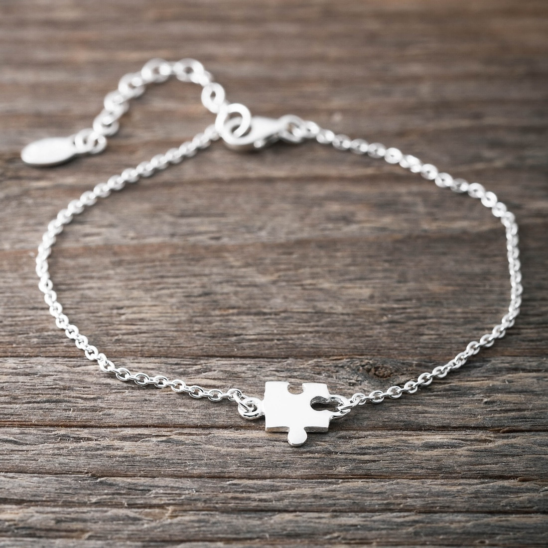 Silverarmband liten pusselbit