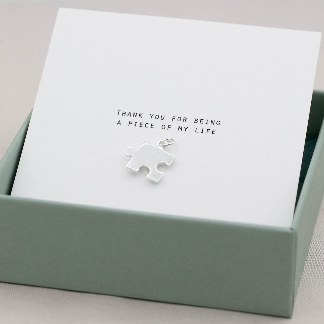 Silver pendent puzzle piece