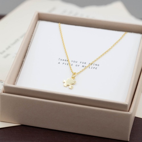 Gold necklace small puzzle piece