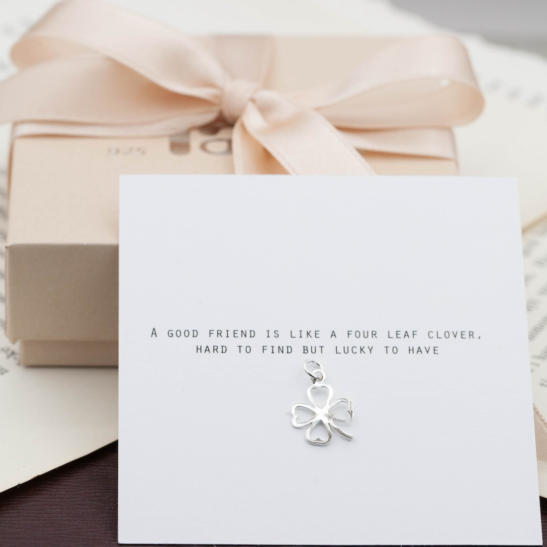 Silver charm four leaf clover