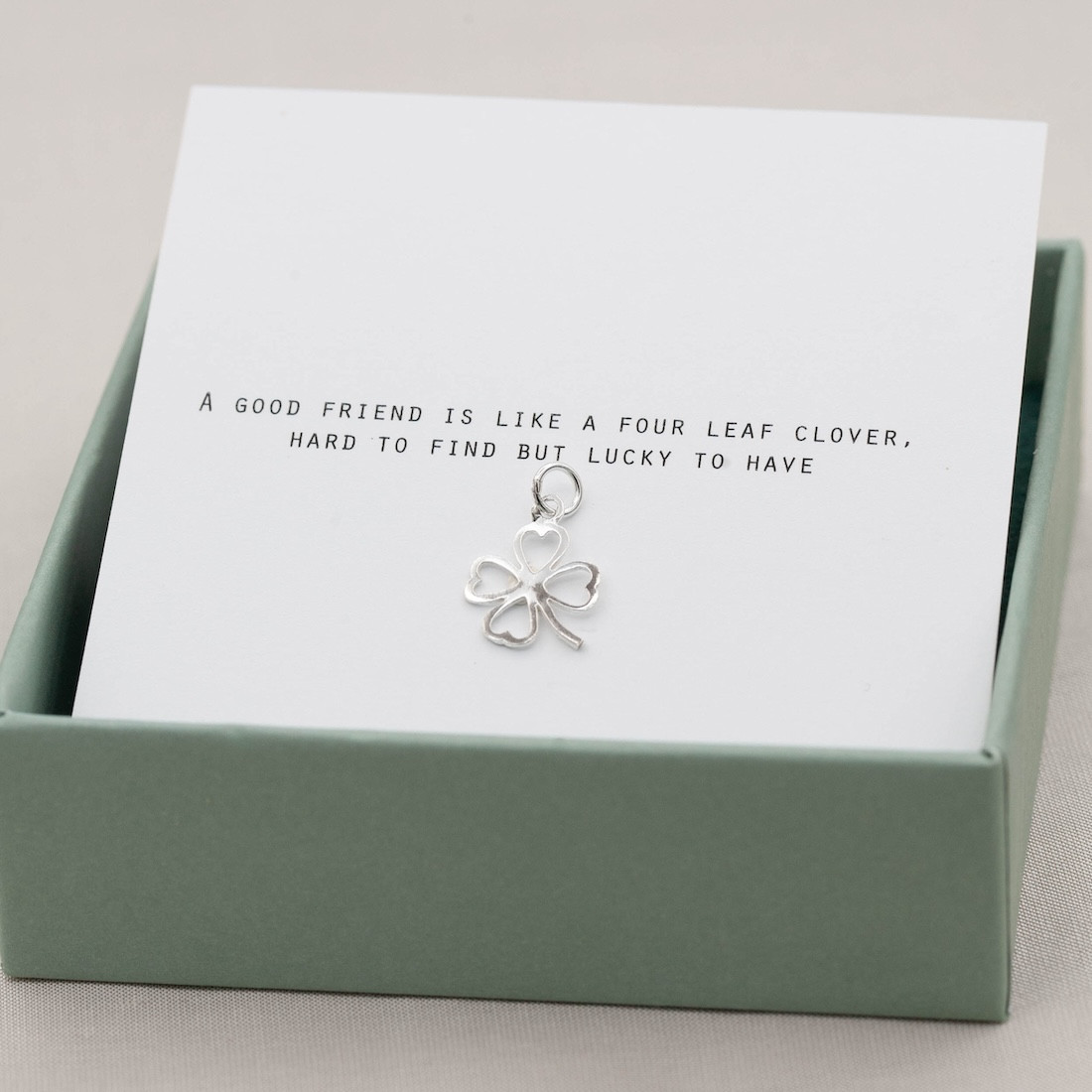 Silver charm four leaf clover