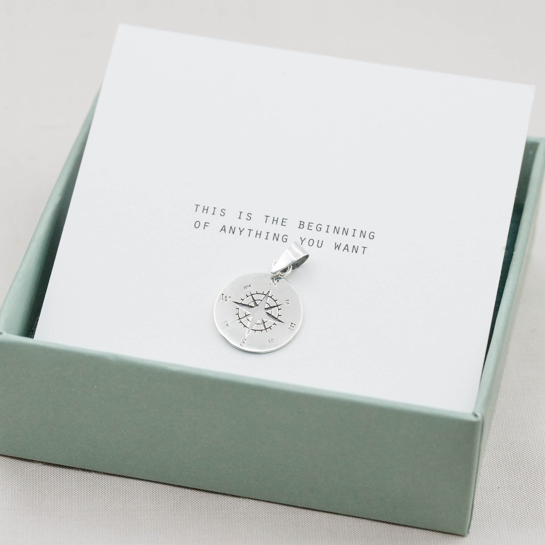 silver pendant big compass