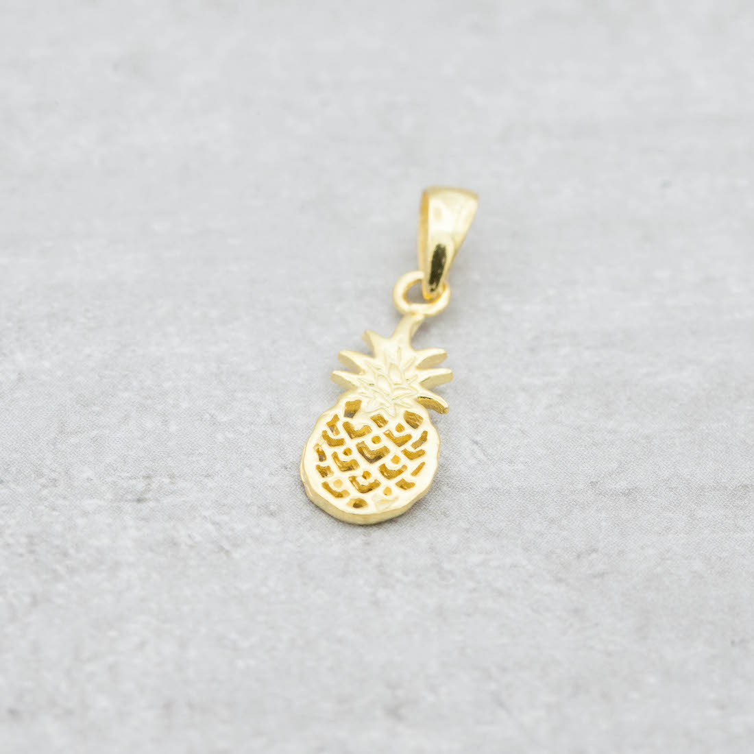 Gold  necklace with a pineapple