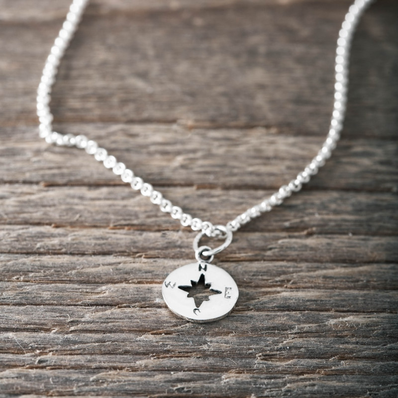 Silver necklace compass