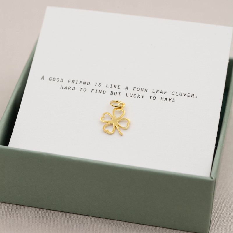Gold charm four leaf clover