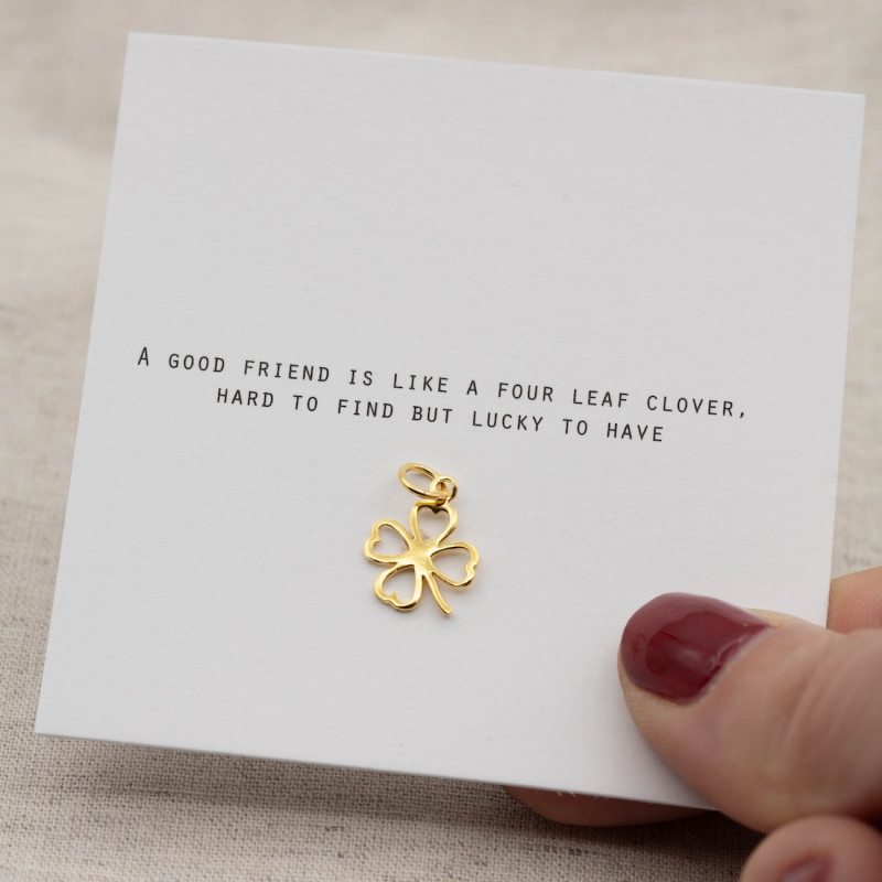 Gold charm four leaf clover