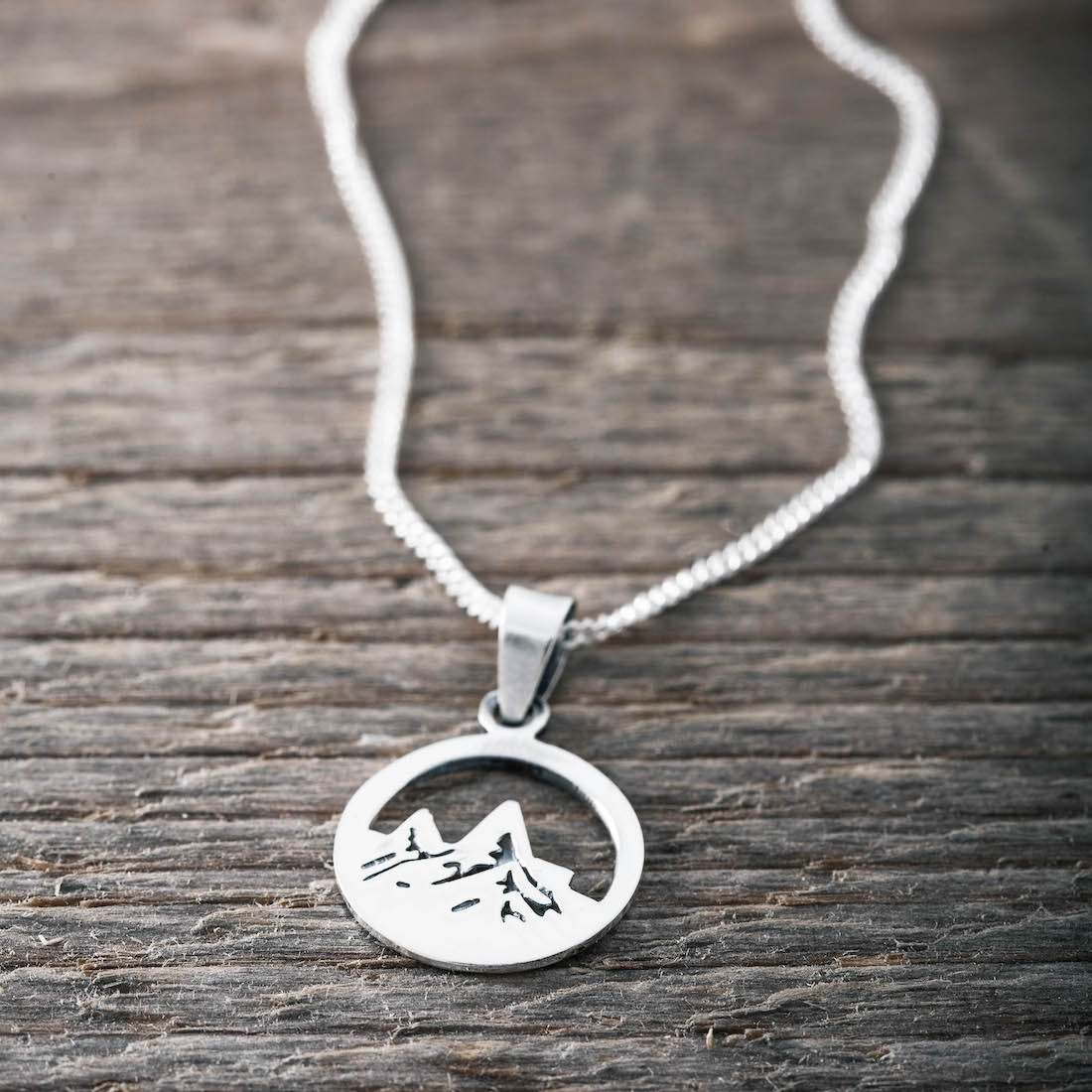 Silver necklace mountain top