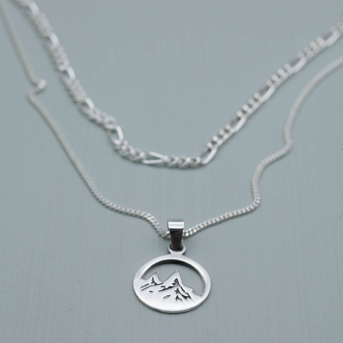 Silver necklace mountain top