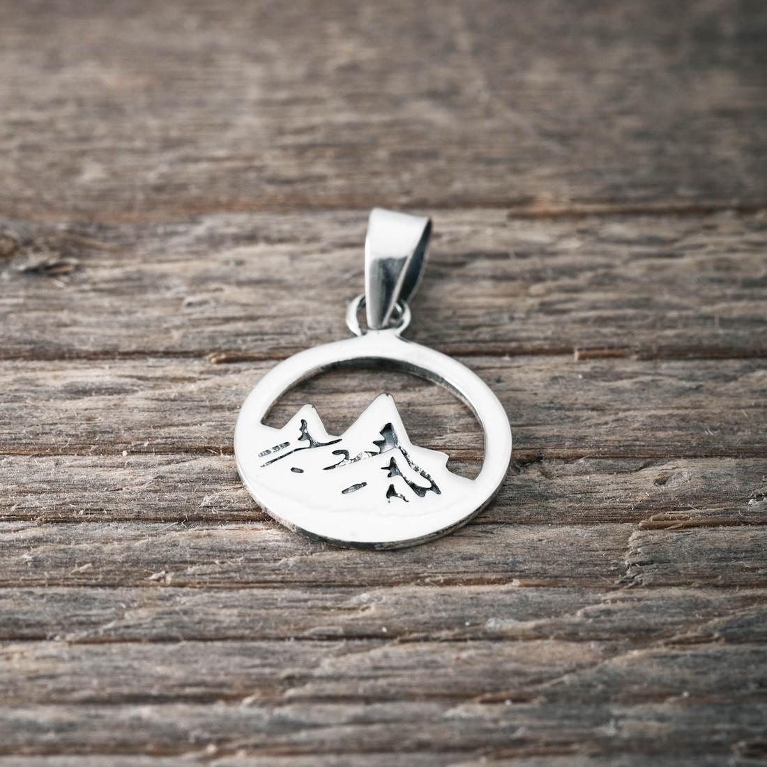 Silver pendant mountain top